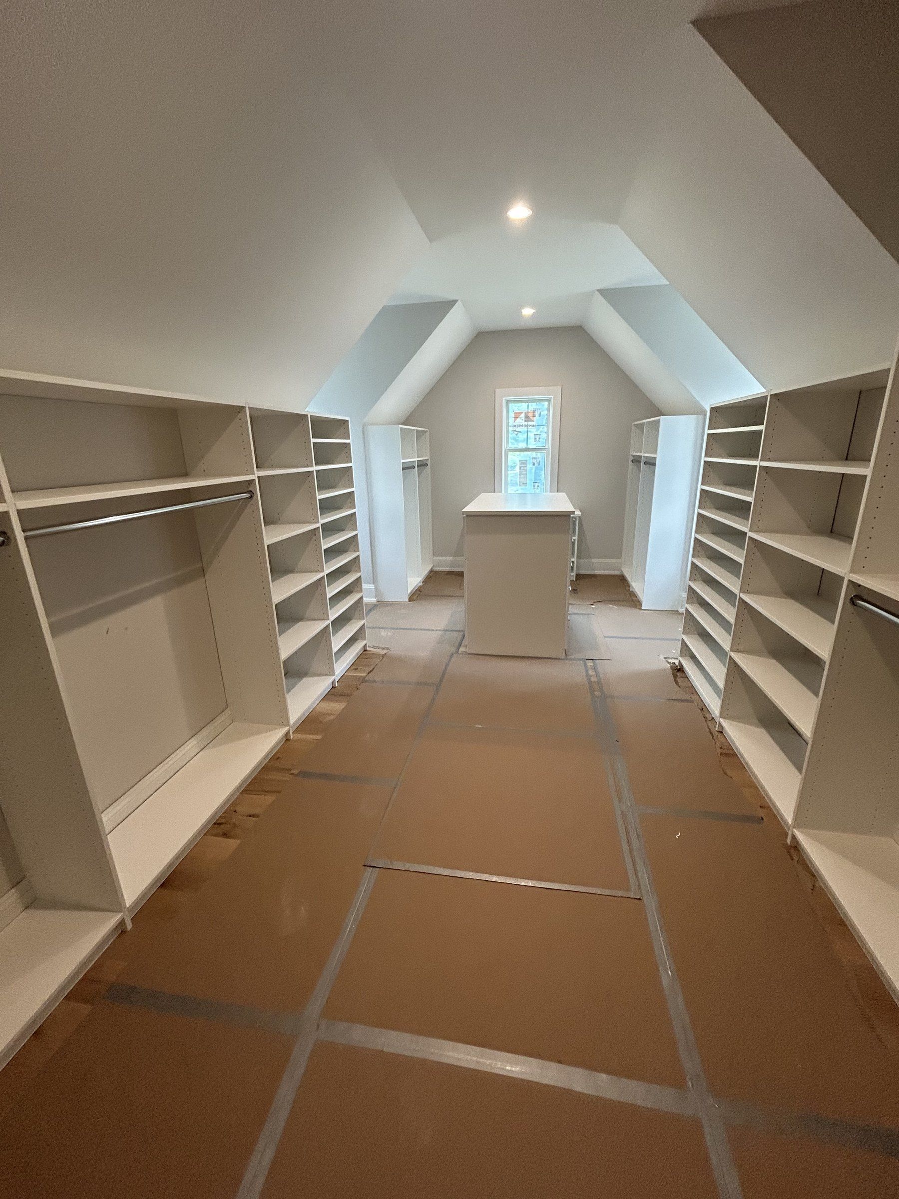 Attic walk-in closet sloped ceiling, installed by Closets For Less