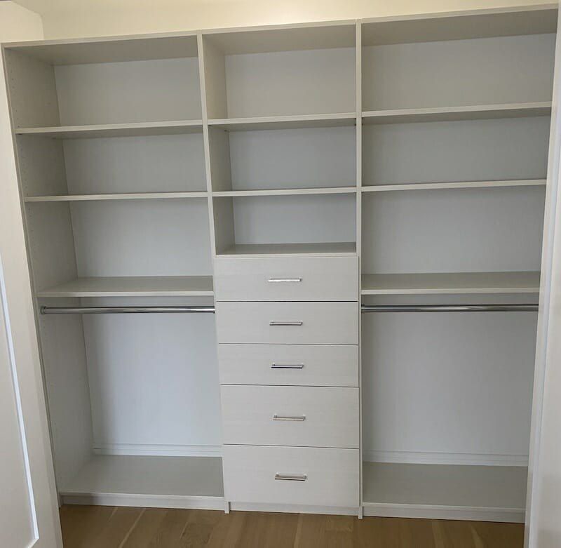 Closet drawer tower white shelving, installed by Closets For Less