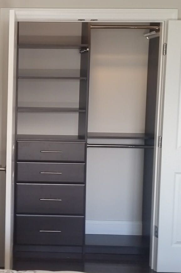 Charcoal reach-in closet with a four-drawer base