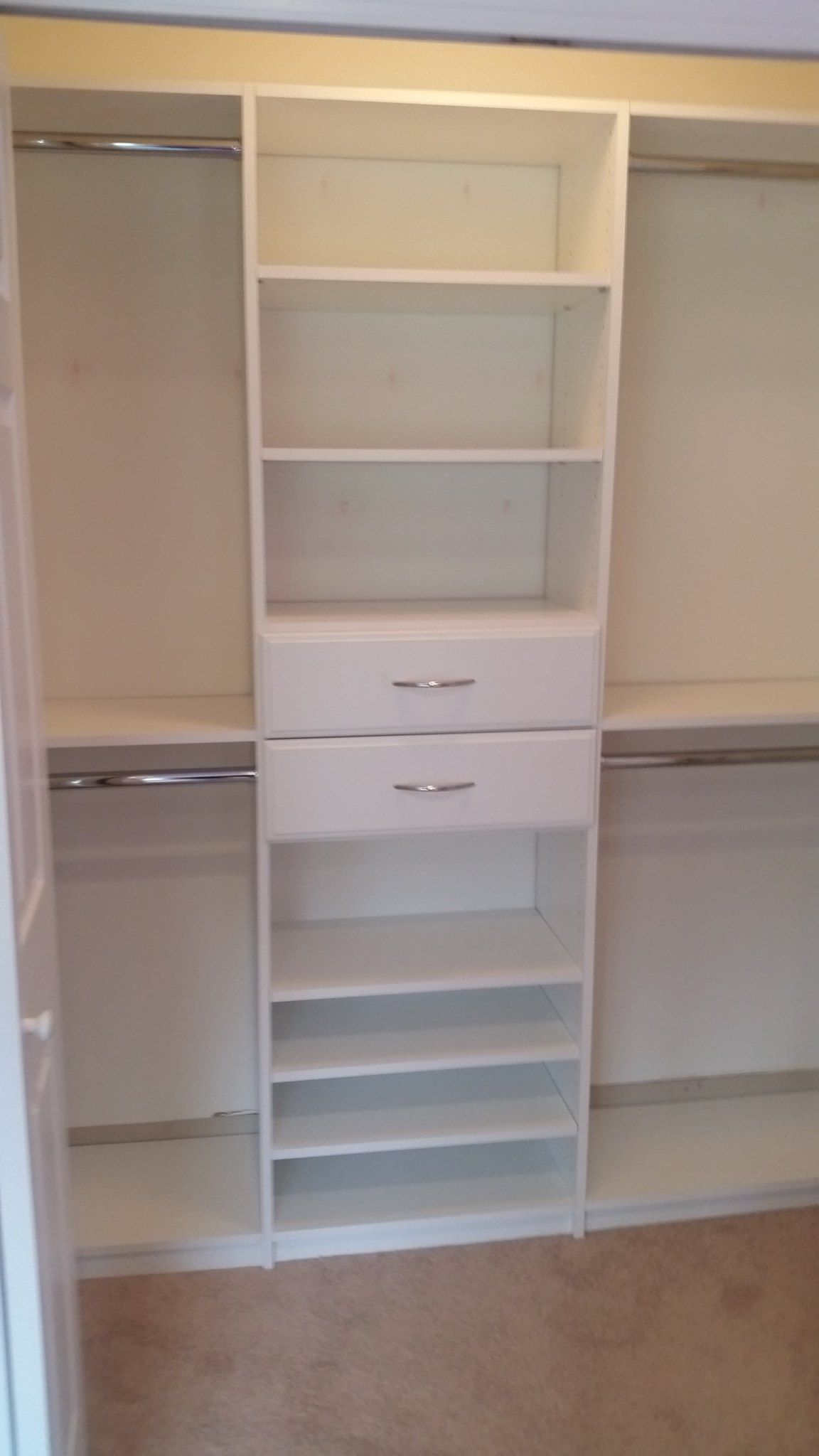 Reach-in closet white shoe shelves, installed by Closets For Less