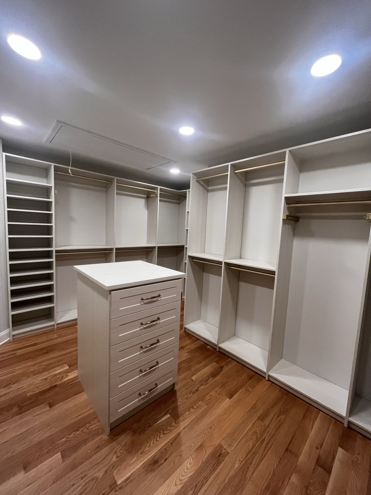 Walk-in closet island drawers, installed by Closets For Less