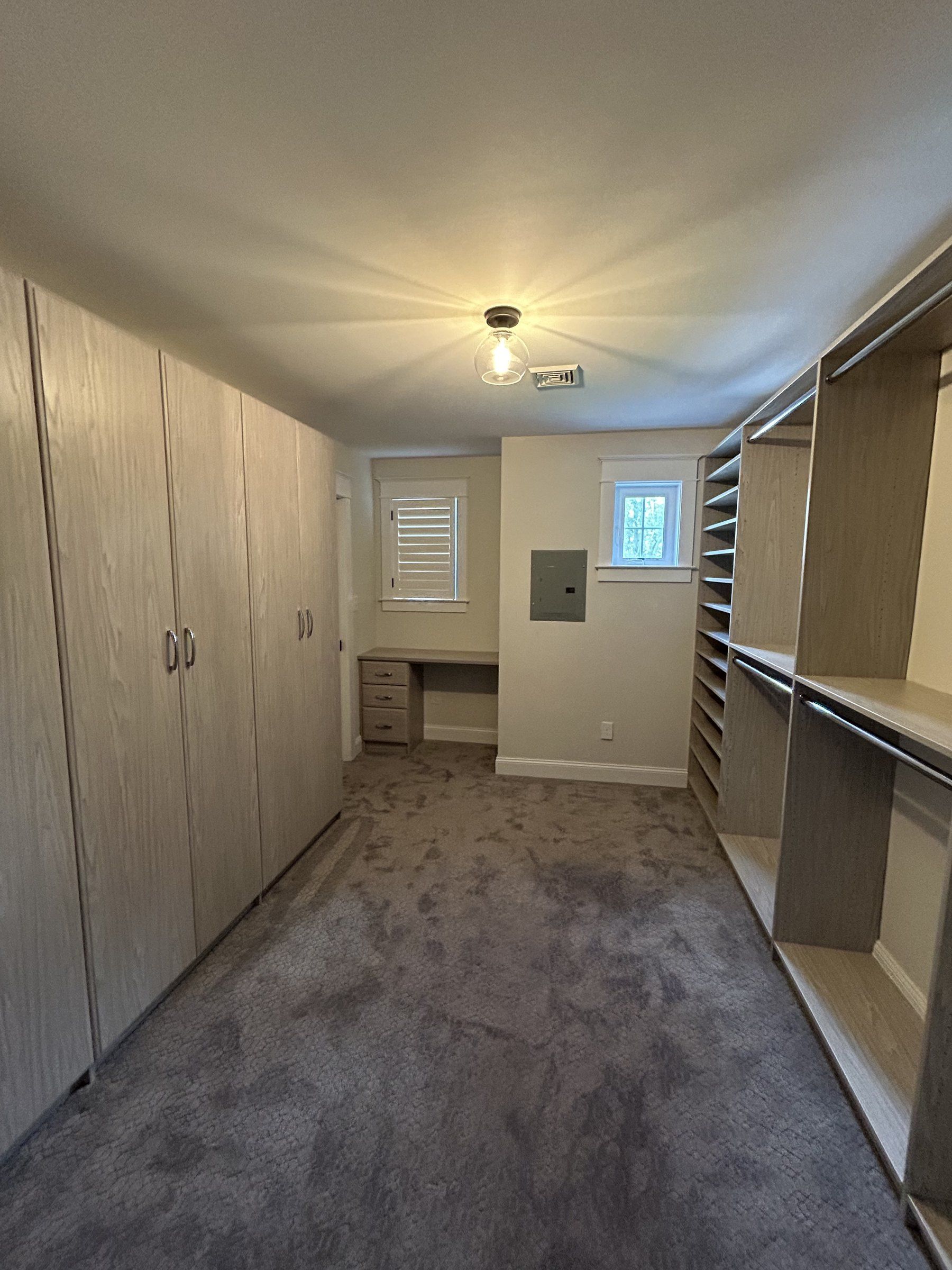 Wood grain walk-in closet cabinets, installed by Closets For Less