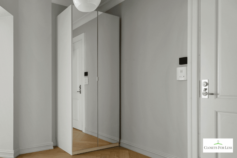 Full-length mirrors on mudroom closet doors for light reflection