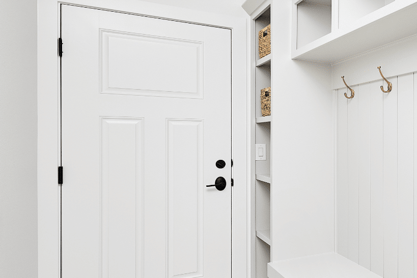 Narrow mudroom utility closet for umbrellas and cleaning supplies