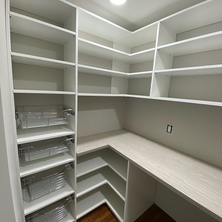 beautiful custom pantry storage in Radnor, PA home with preparation table high and low shelving and maximum storage