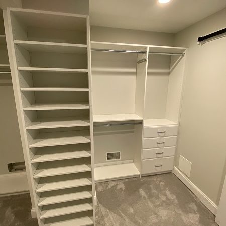 custom walk-in closet storage solution in radnor pa with white shelving large shoe rack and hanging bars